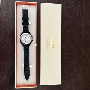 Black rubber Coach watch with silver accents